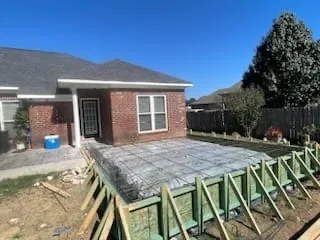 Concrete patio slab formwork behind a home, Pearl, MS