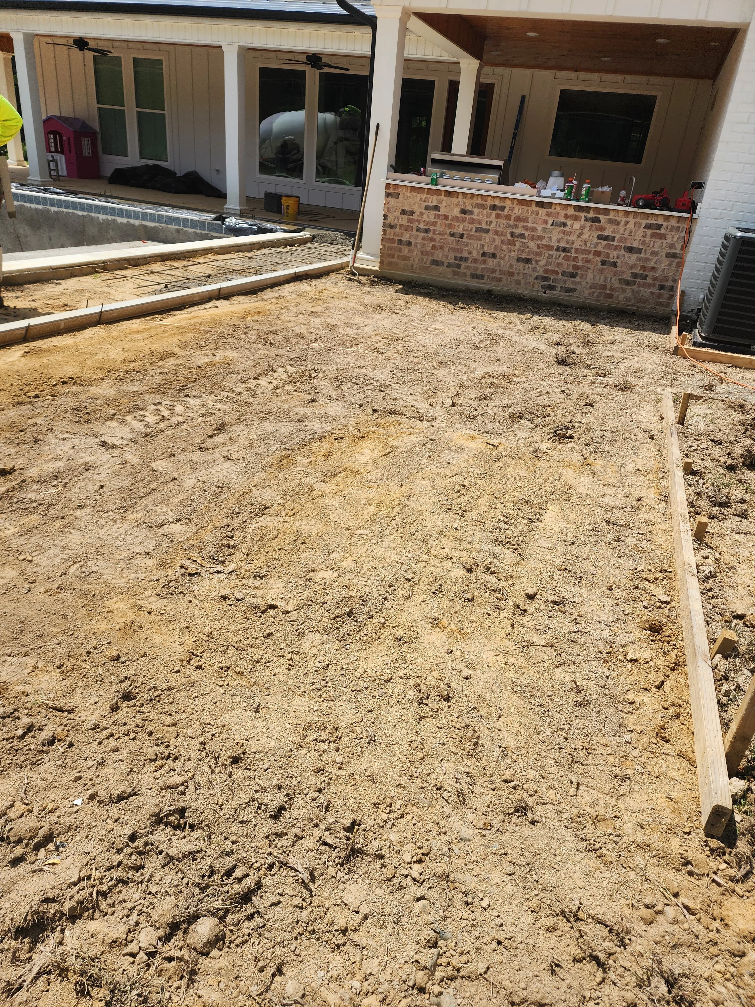 Concrete work crew on a residential jobsite, Pearl, MS